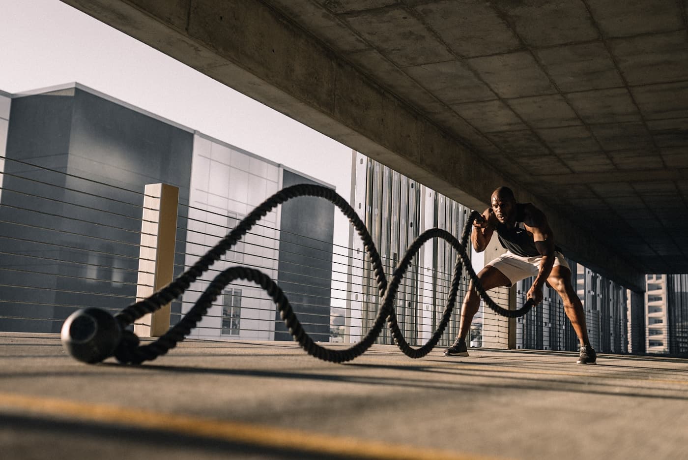 Athlete building power with battle ropes
